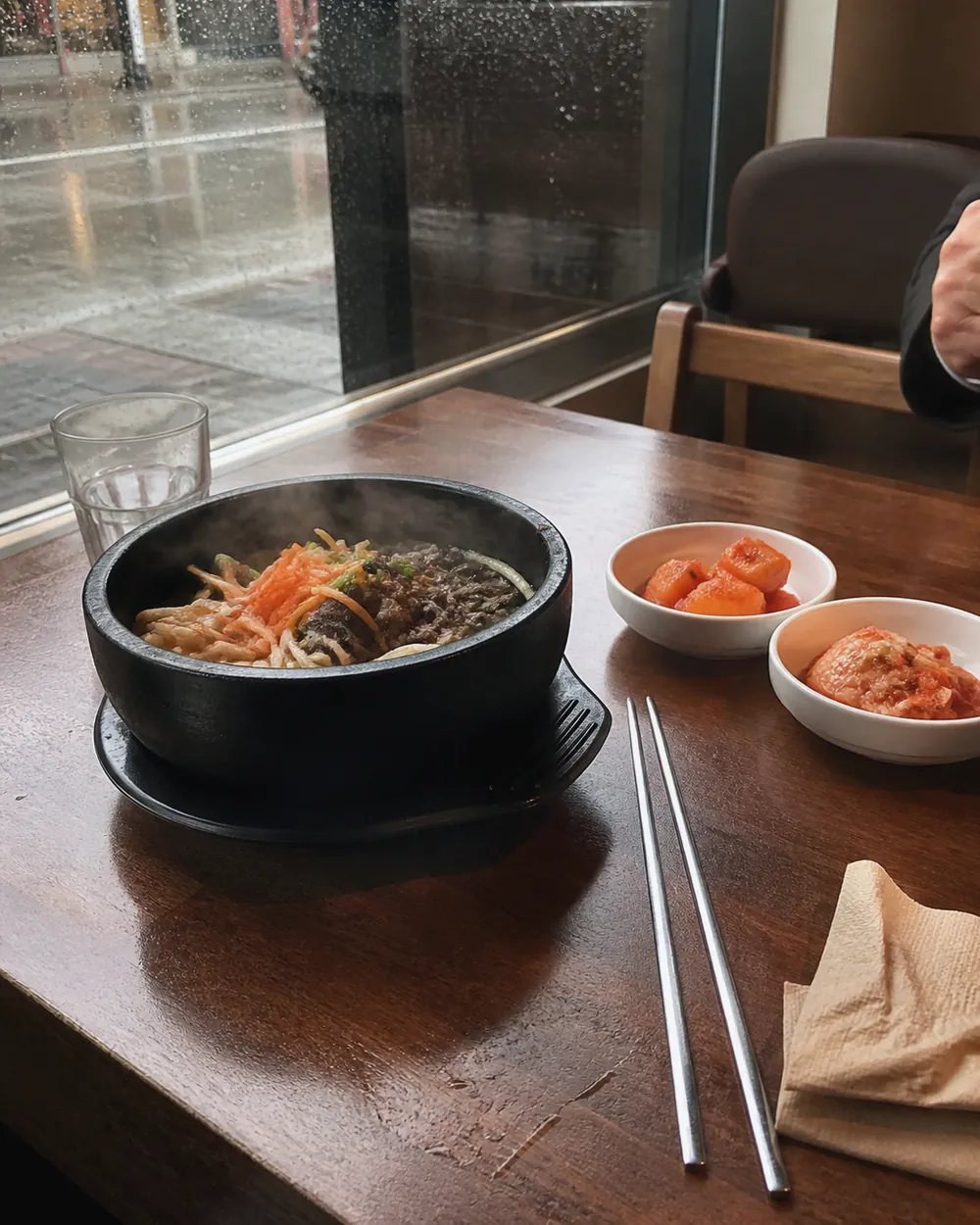 A naturally arranged restaurant table with shared dishes